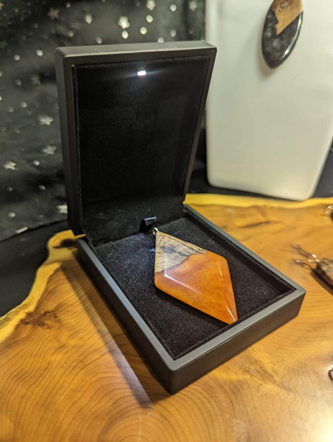 Orange diamond wooden ornament in cushioned box