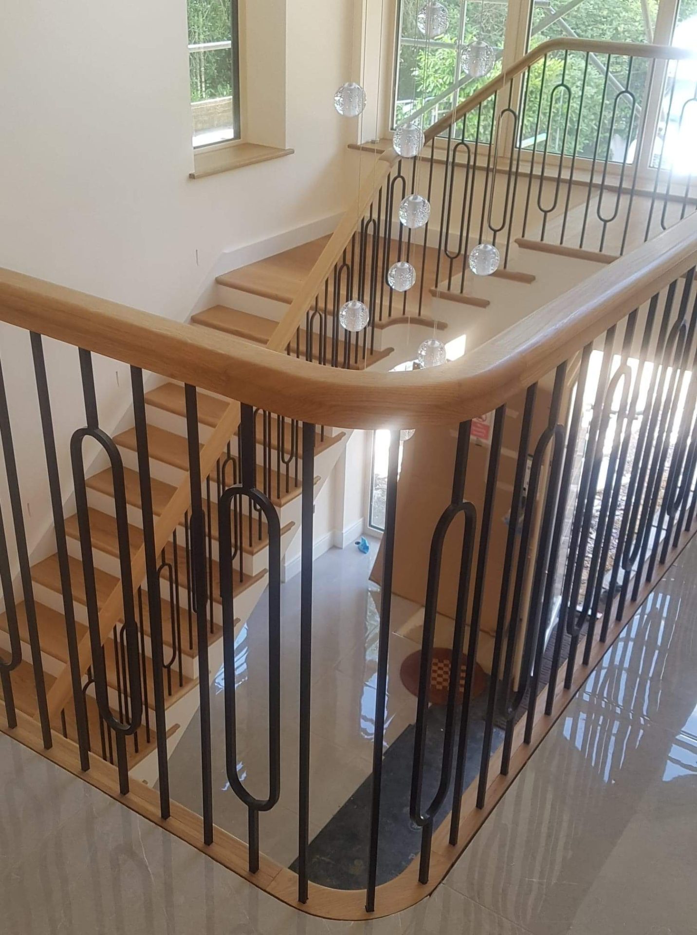 Wooden staircase with landing and metal banister supports iron spindles ,polished oak handrail, Basingstoke, Fleet, Newbury, Tadley, Reading, Hartley Wintney, Hook Thatcham, Winchester, Wokingham, Finchampstead, Camberley