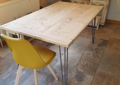 Industrial style made to order kitchen table with metal legs and wooden reinforced top