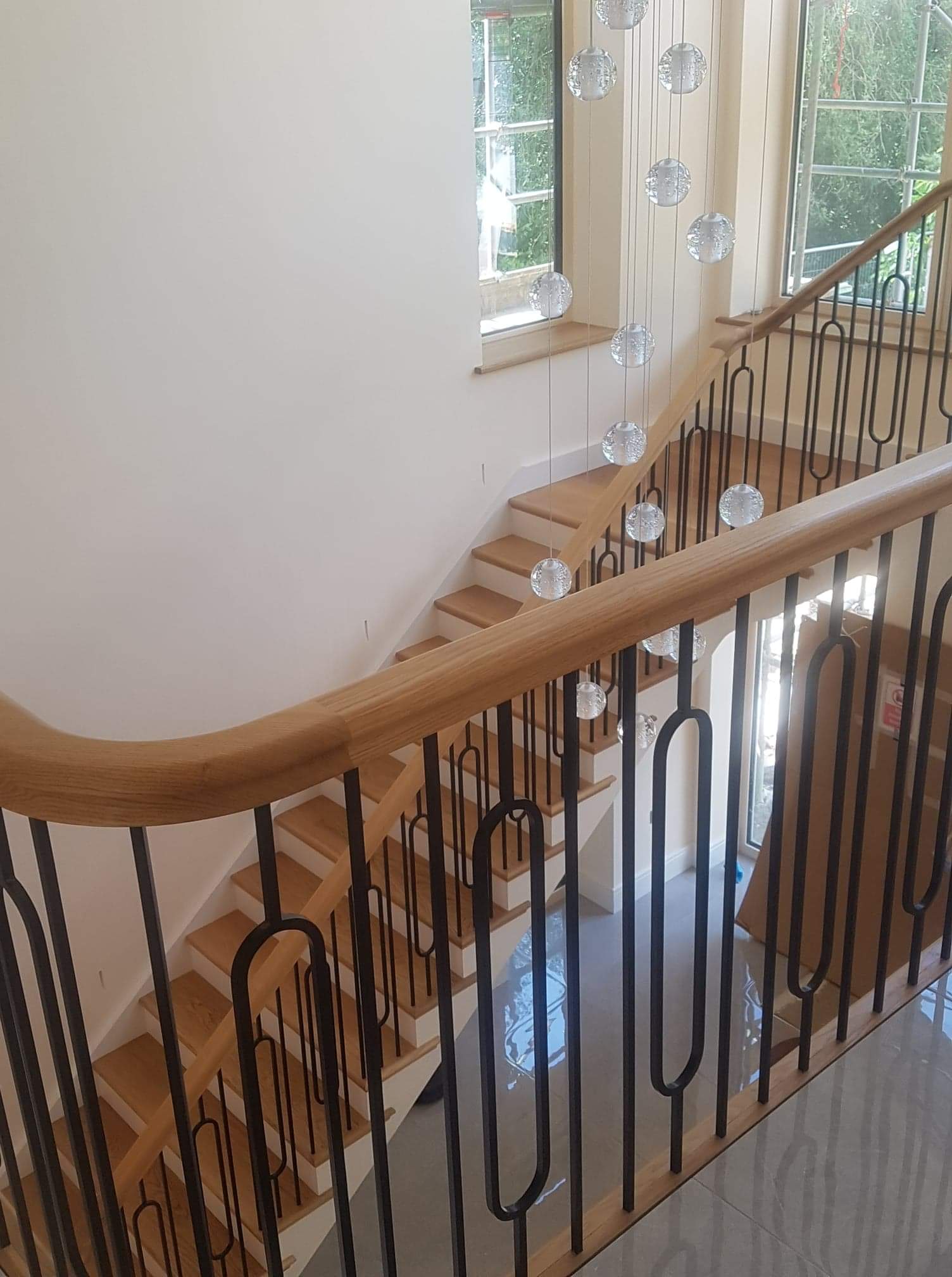 Oak staircase new build and iron spindles, chandelier, hallway