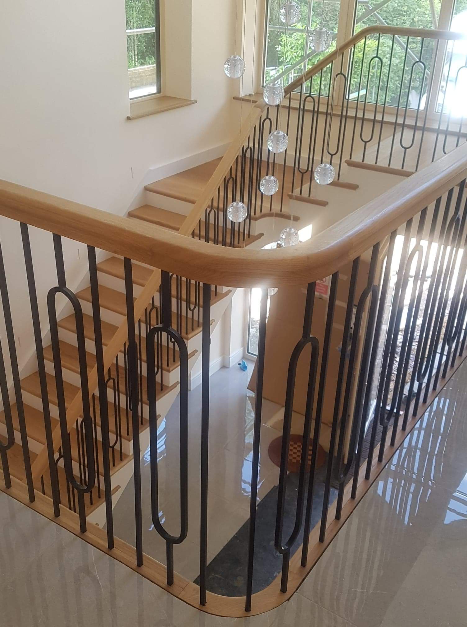 Wood restoration near Basingstoke, Wooden staircase with landing and metal banister supports iron spindles ,polished oak handrail, Basingstoke, Hook, Fleet, Newbury, Tadley, Reading, Hartley Wintney, Hook Thatcham, Winchester, Wokingham, Finchampstead