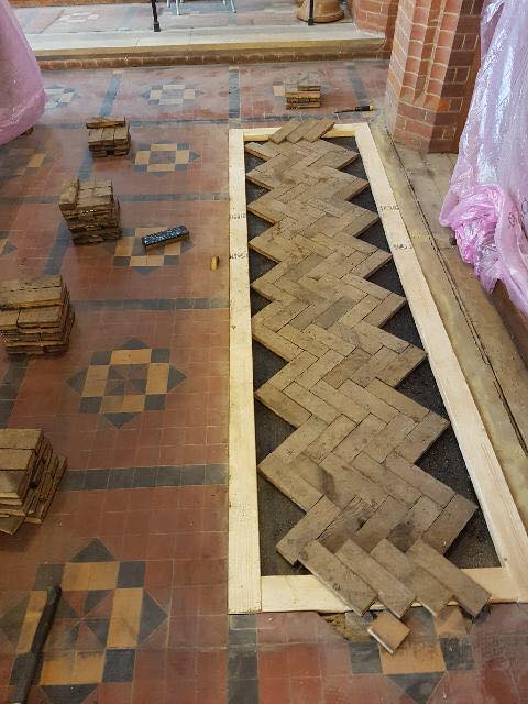 Laying floor tiles in Church